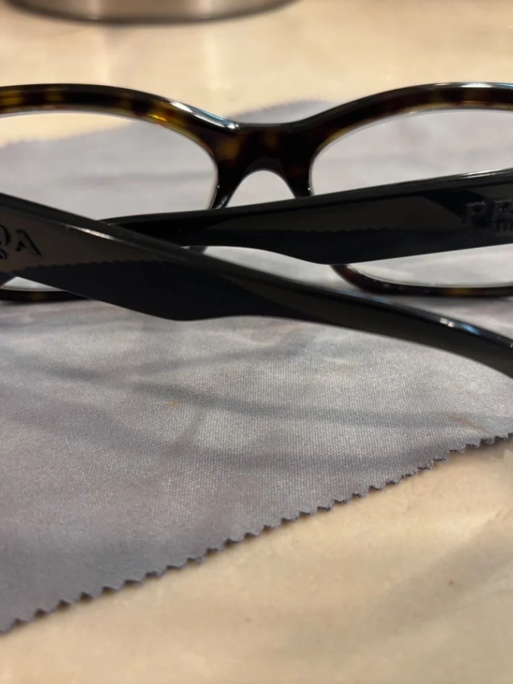 Lot of used Prada and Tom Ford glasses.